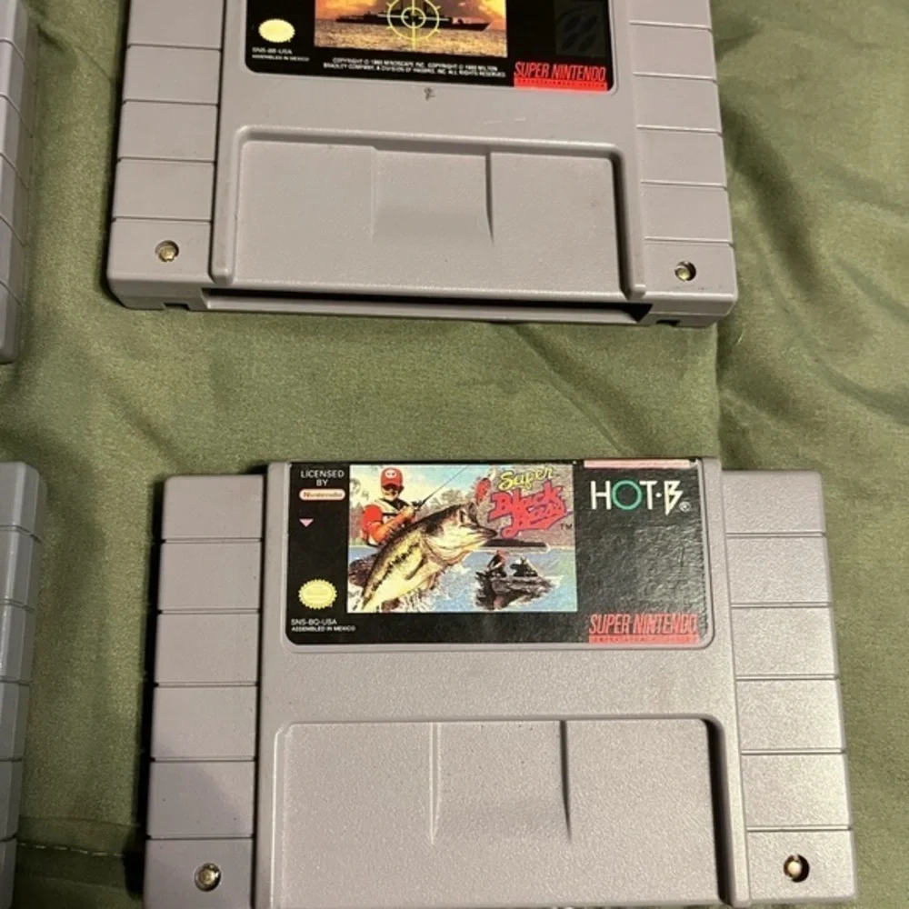 Super Nintendo set of four games battleship, nhl, bass , golf description in pic